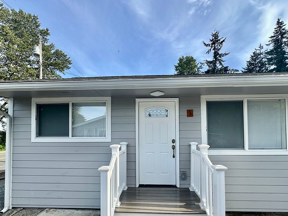 Unit 1 of a duplex with new roof, gutters, painted hardie board siding, and Vinyl + Trex decking. Off street parking provided next to unit on left side of building.