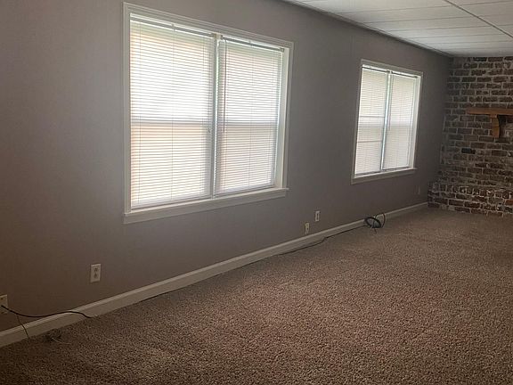 Another view of living area with windows