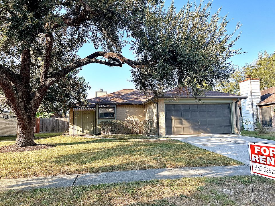 Freshly painted exterior with a beautiful big oak tree out front!