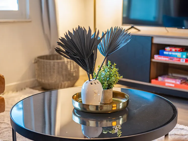 Small, modern decorative centerpiece adding a touch of elegance.