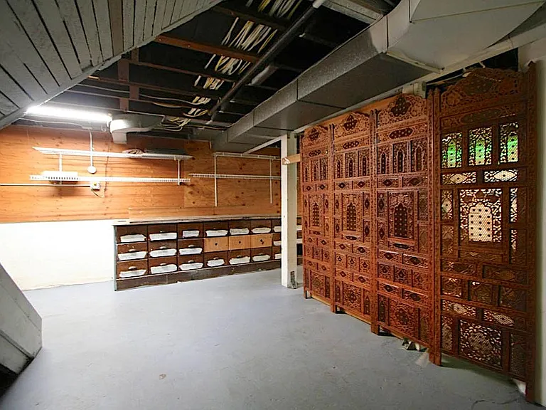 more daylight basement (heated) showing storage/ tool area