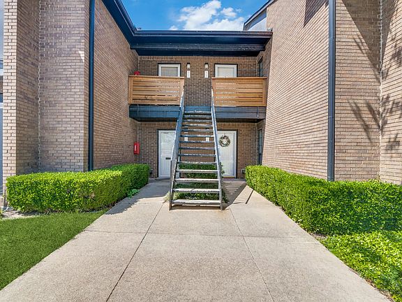 Unit 202 is located at the top of the stairs and to the right.