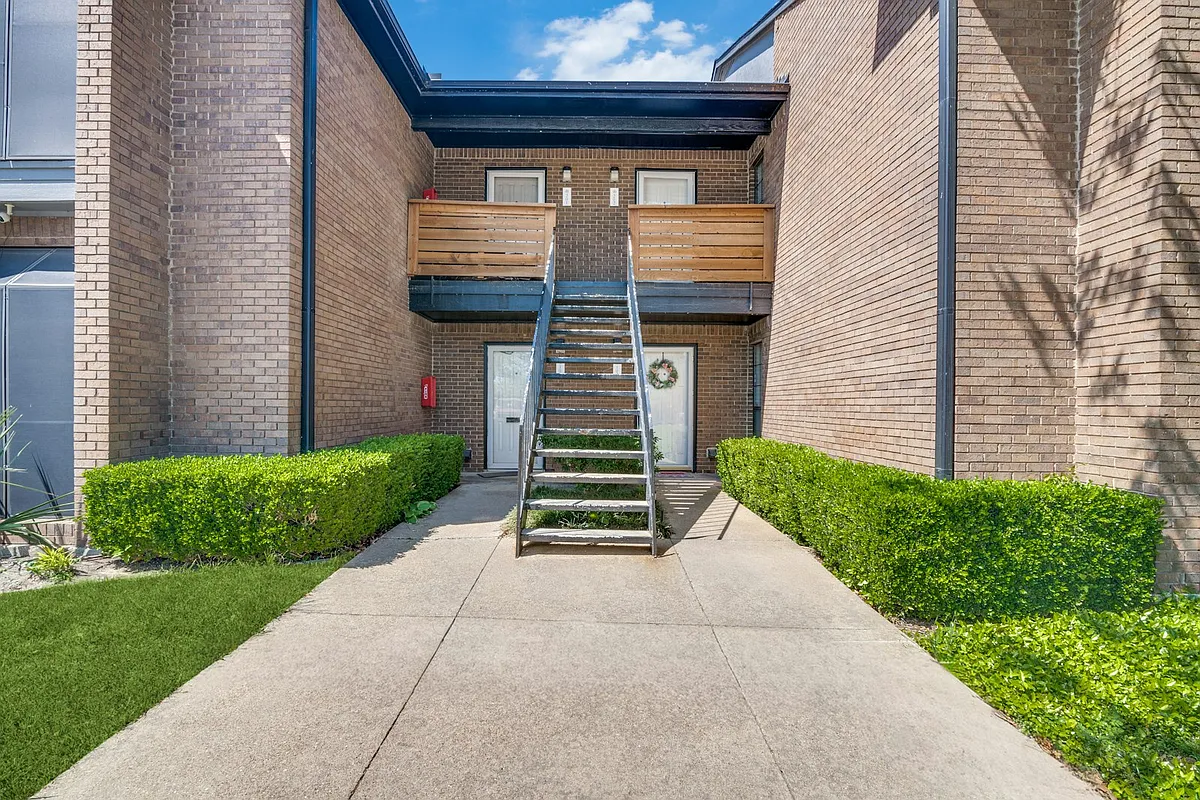 Unit 202 is located at the top of the stairs and to the right. - 4412 Chaha Rd #202