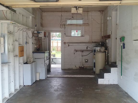 one car garage with work area and laundry hookups
