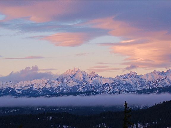 Floating above the clouds on a wintry morning. This majestic view just takes your breath away. Photo of Mt. Stuart taken from the great room.