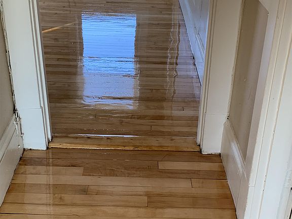 Hallway from eat-in kitchen to livingroom. Hardwood floors recently refinished