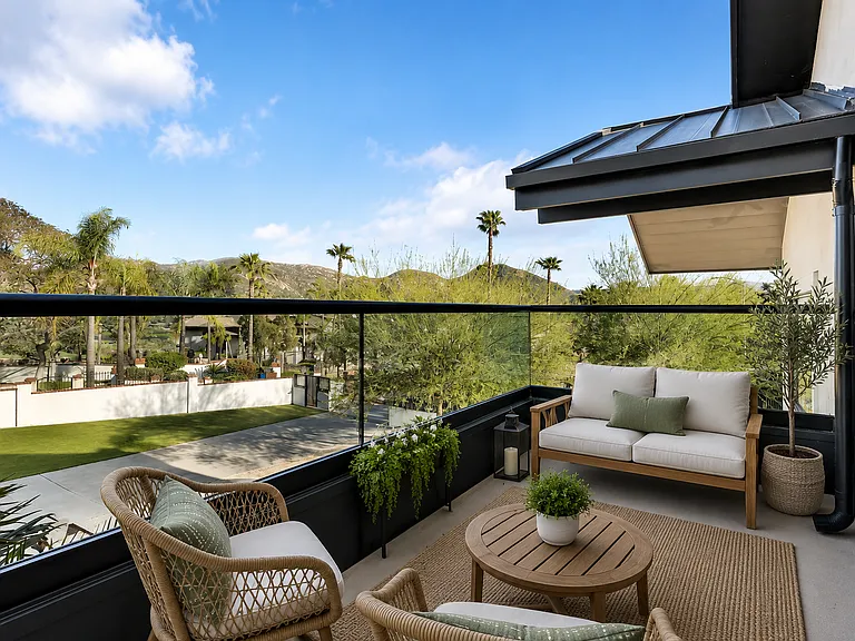This is the balcony off of the 2nd floor east facing bedroom complete with full height glass balcony railings. All balconies are provided with exterior outlets for ease of use.