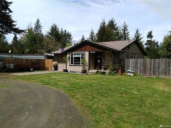 Front of home showing part of the circular drive way.