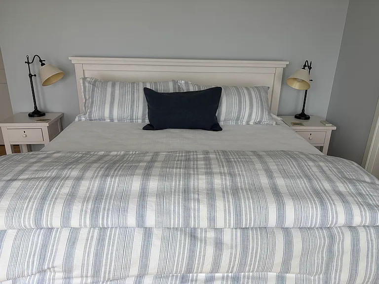 Master bedroom with door to ensuite bathroom. Sweeping views.