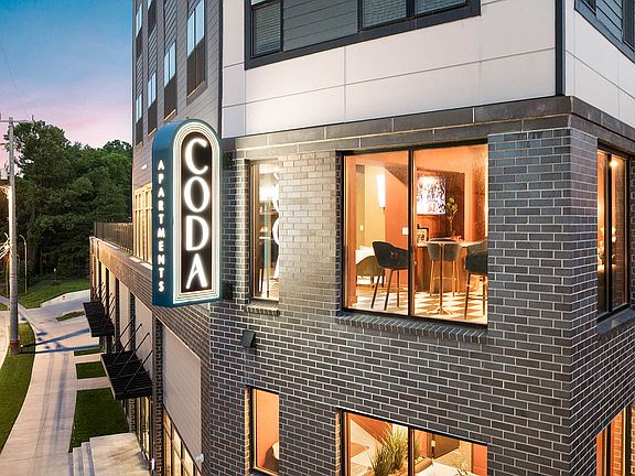 CODA sign at night with more exterior
