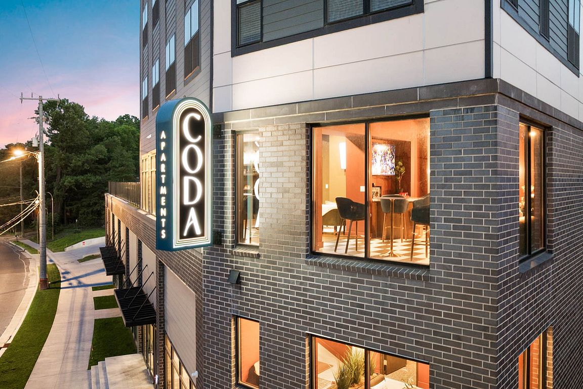 CODA sign at night with more exterior