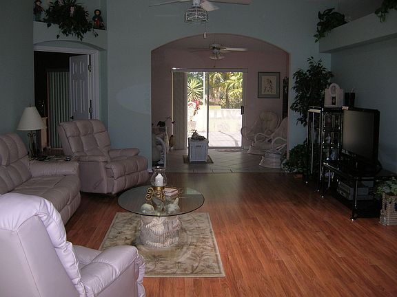 View from front door through living room and fl. room to patio