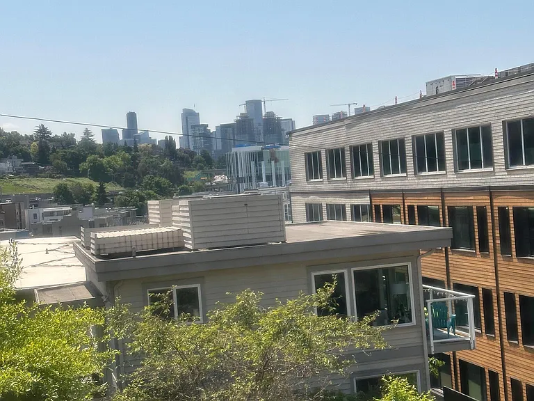 View of Downtown Seattle from living and dining area and both bedroom windows