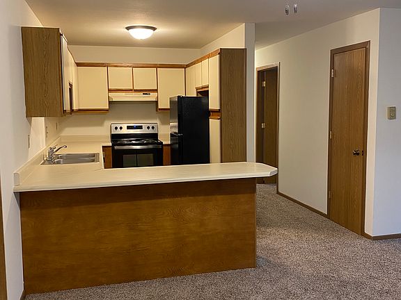 entrance to apartment, dining area, snack bar and kitchen