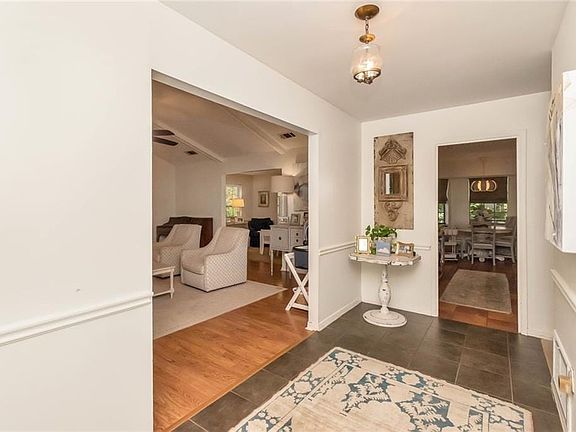 Enter into a traditional foyer. The living room is to the left.
