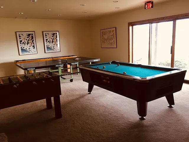 Community game room has billiards, foosball, ping pong and shuffleboard