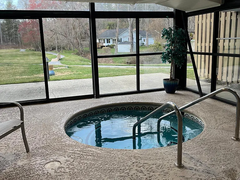 Hot Tub and view of walking trail and golf green.