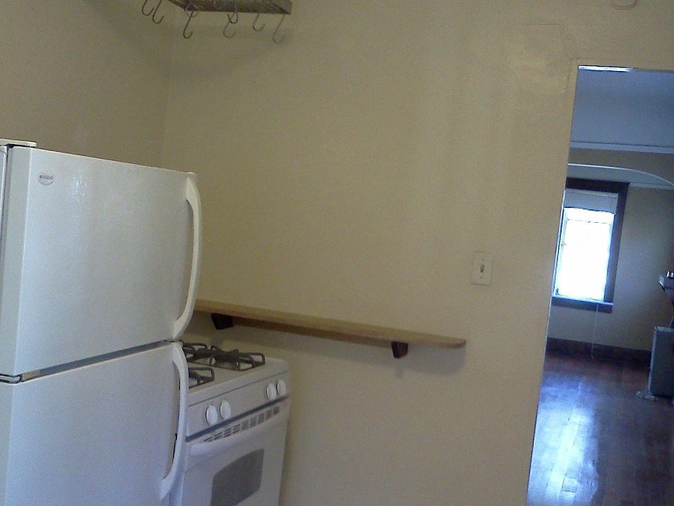 Kitchen with stove, refrigerator. No disposal or dishwasher.