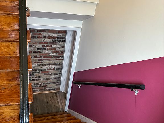 Stairs from the shared entrance to the mud room.