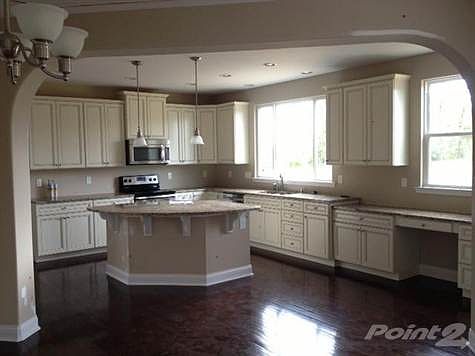 Gorgeous kitchen with tons of cabinet space and planning desk
