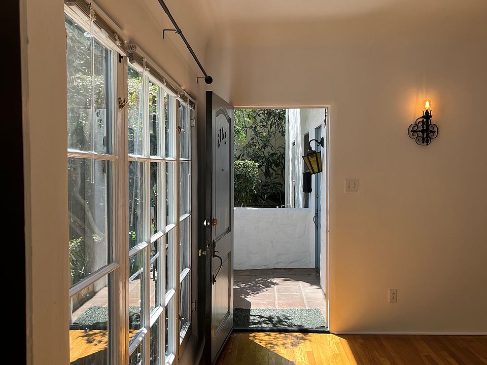 Bedroom entrance looking to exterior front door entrance.