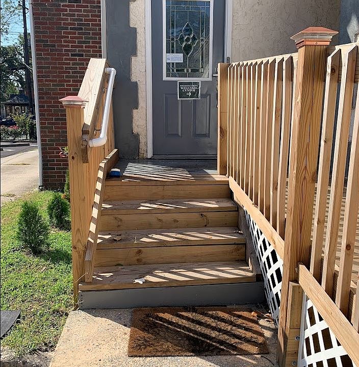 Off street entrance with security camera, lighting, and security code.