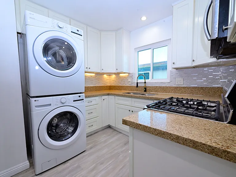 fully upgraded kitchen and in-unit laundry