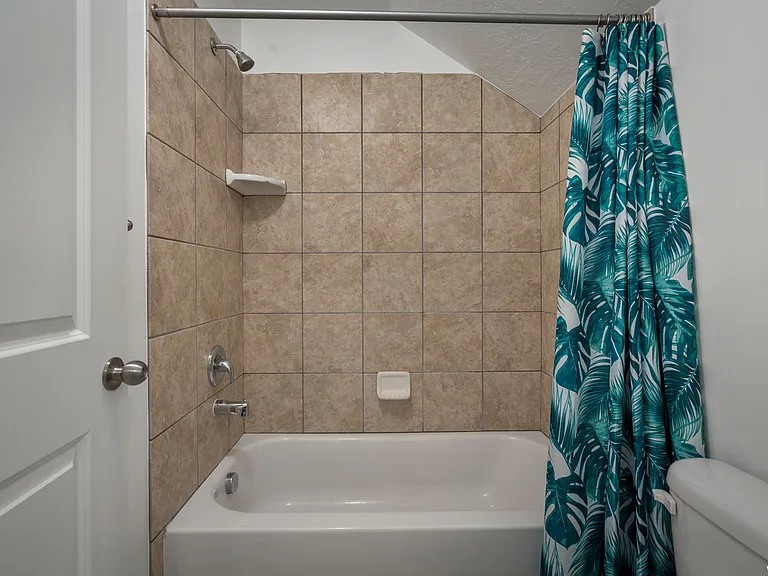 Upstairs tub shower and toilet.