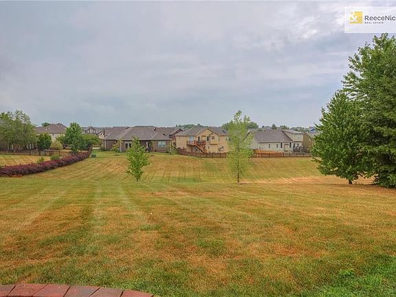 Huge yard .61 acres with greenspace lot next door