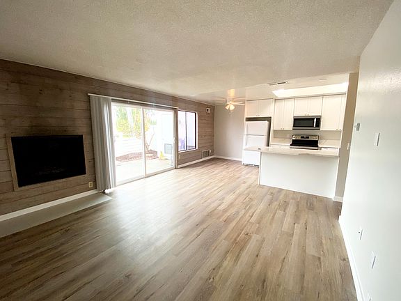 Living room, dining area and kitchen