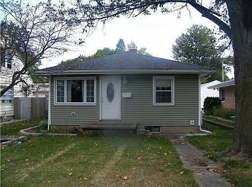 Front exterior of this maintenance free home with newer roof/windows/siding