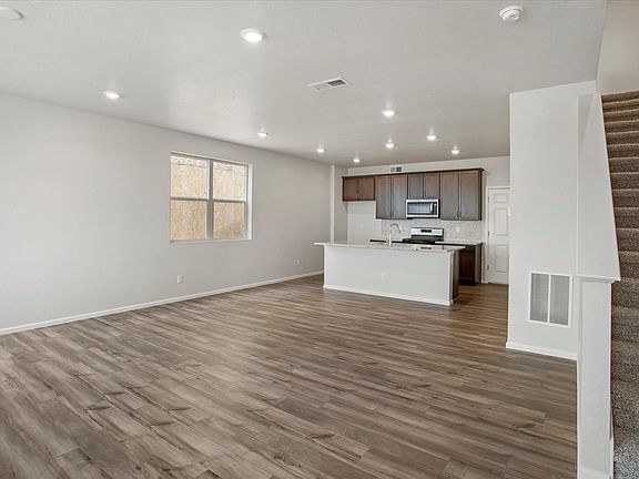 The open-concept kitchen spills into the dining room allowing for an open feel.