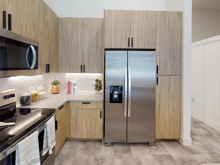 Gourmet kitchens with stylish mosaic tile, quartz countertops and plentiful storage. Some homes feature double-door refrigerators with water dispensers and dedicated pantry space too!