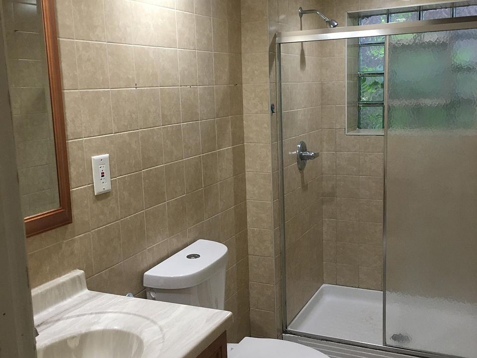 Bath, stand up shower, no bathtub.
