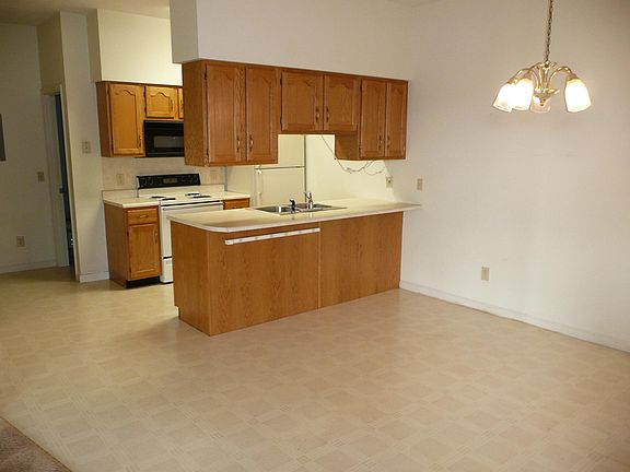 Galley kitchen & eating area from entrance door