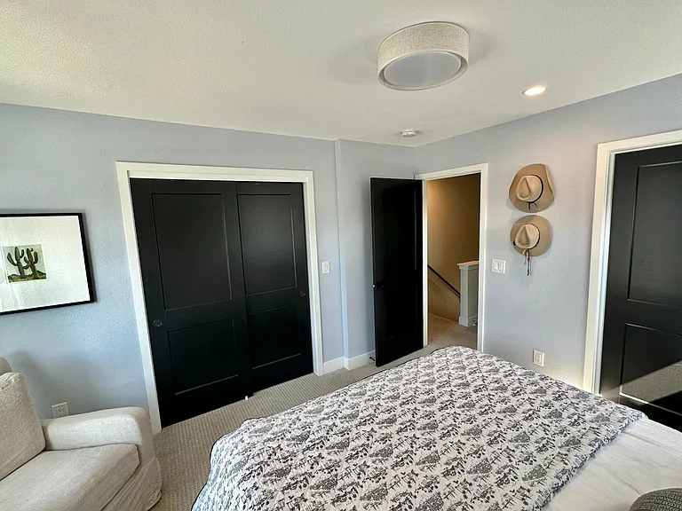 Bedroom 1 - sliding closet doors and bathroom access