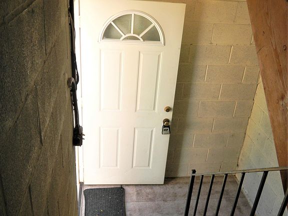 Private lower door entrance with stairs leading up to 3rd floor apartment.