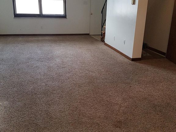 LARGE LIVING ROOM/DINING AREA WITH CLOSET UNDER STAIRS