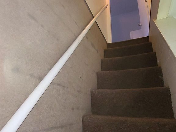 Stairway entrance looking into apartment