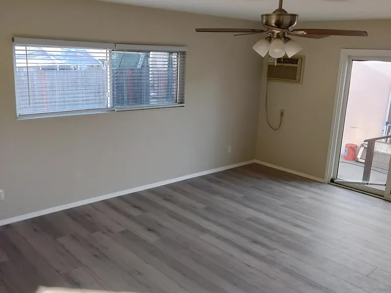 Master bedroom large window and a/c-heat wall unit
