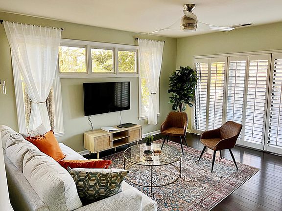 Walk straight outside from the living room if you like! Plantation shutters fitted over the sliding glass doors that open up onto the private covered balcony.