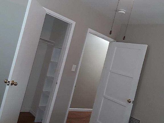 One of three bedrooms with closet
