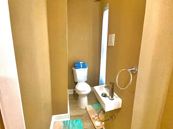 Toilet and sink in master bathroom