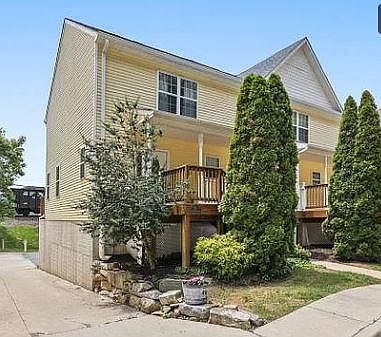 Beautiful end unit townhouse with covered front porch.