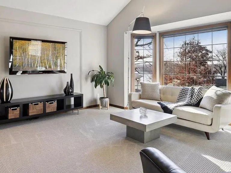 Sun-drenched living room with lake views