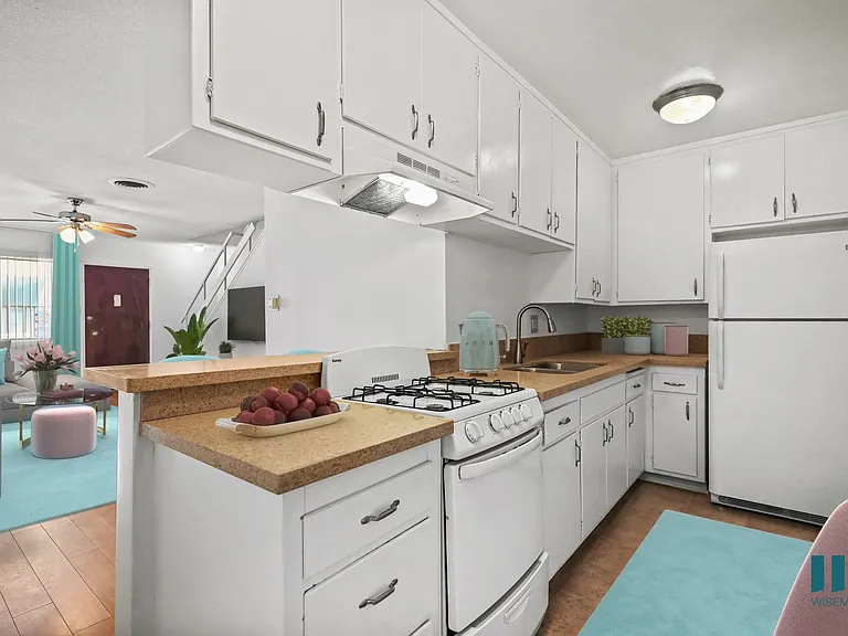 Kitchen with a Stove Oven, Refrigerator, and Ample Cabinet Storage