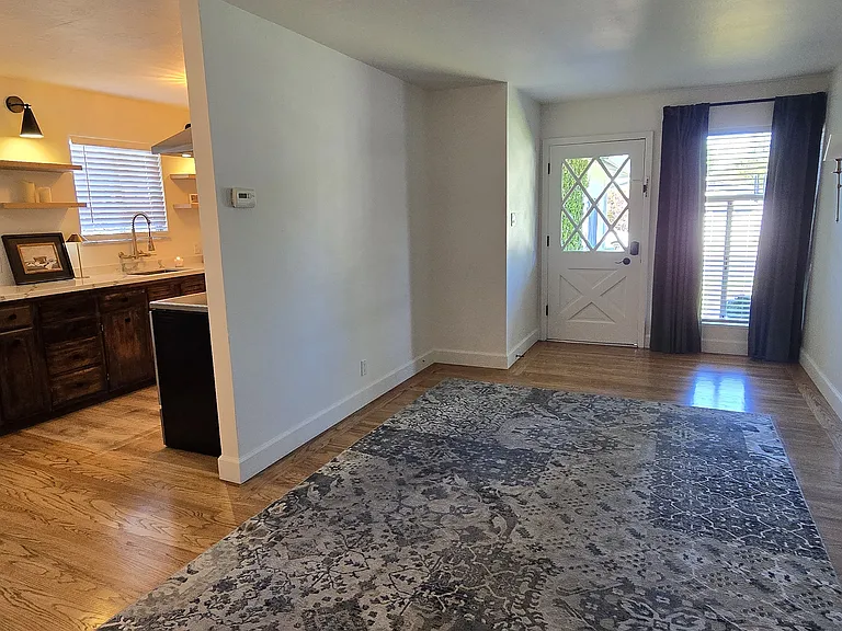 Livingroom with large picture window out to neighborhood views.
