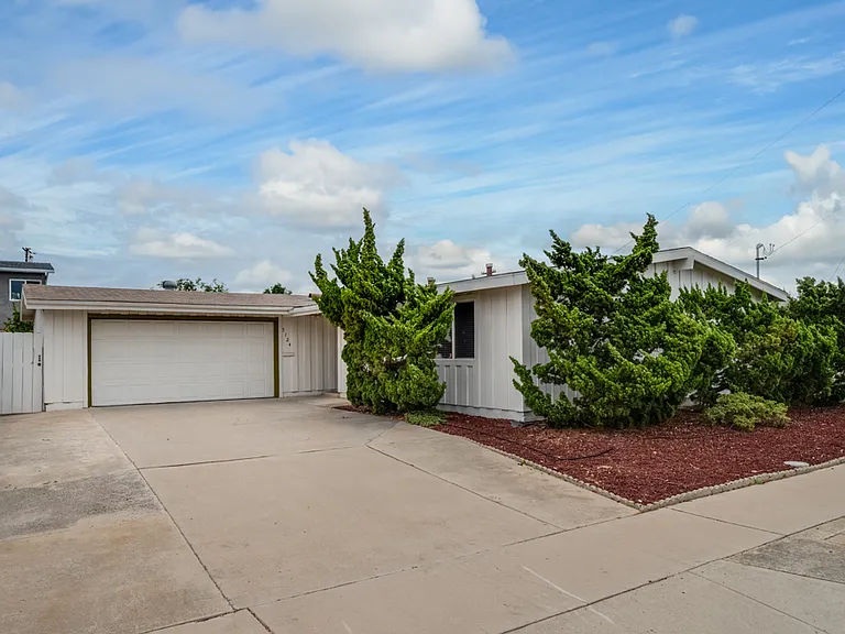 Charming house on a quiet street. Enjoy a large 2-car garage!