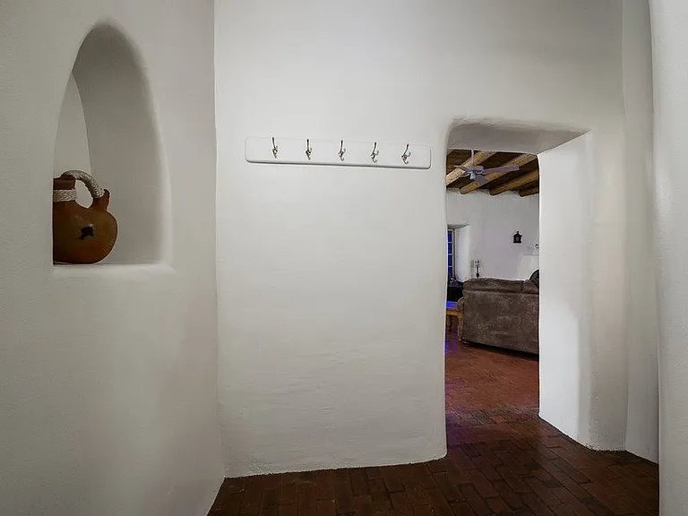 Hallway with coat rack.