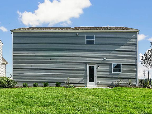 Back exterior of home and yard